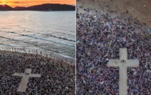 Multidão se reúne em praia de SC para ato de fé.